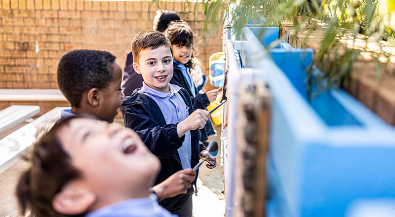 Students playing outside at St John Vianney's Catholic Primary Doonside