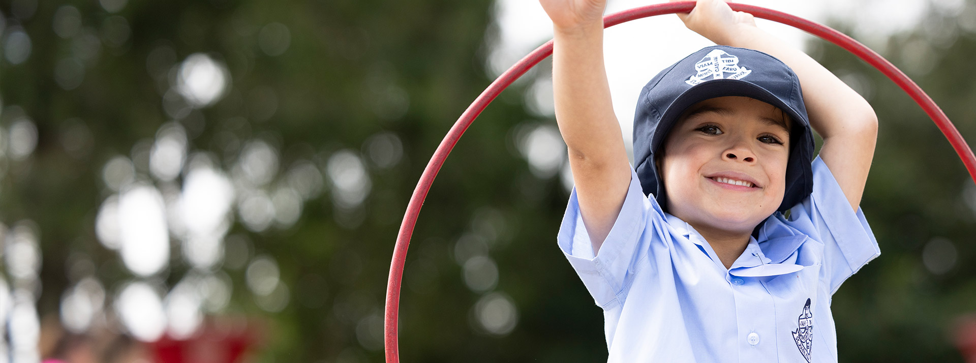 Student playing in the sensory garden at St John Vianney's Primary School Doonside