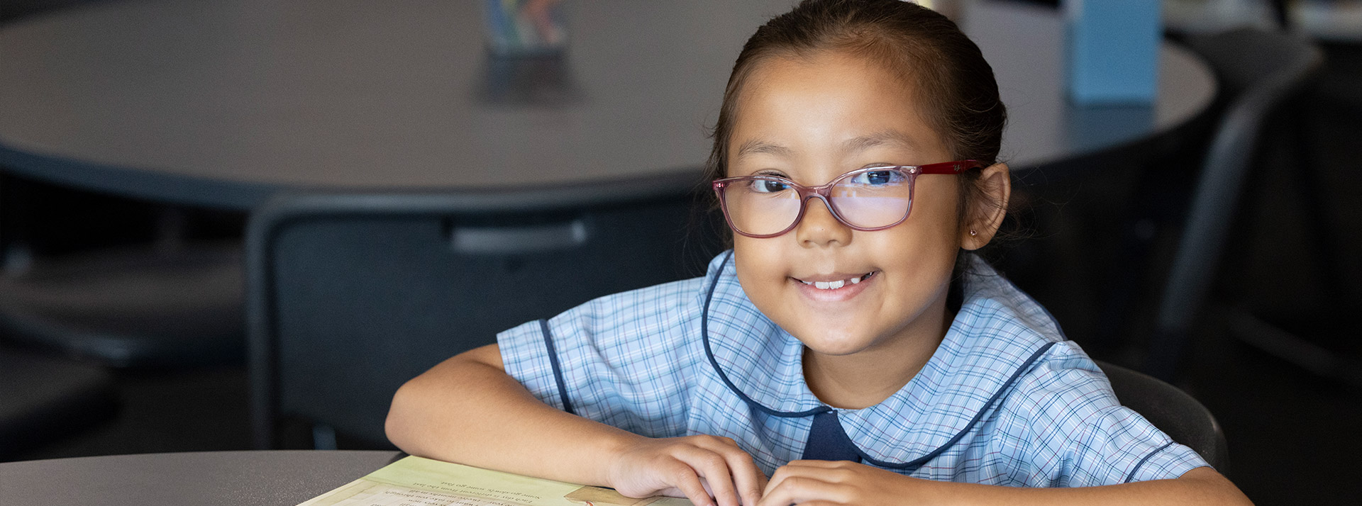 St John Vianney's Primary Doonside Girl reading from book