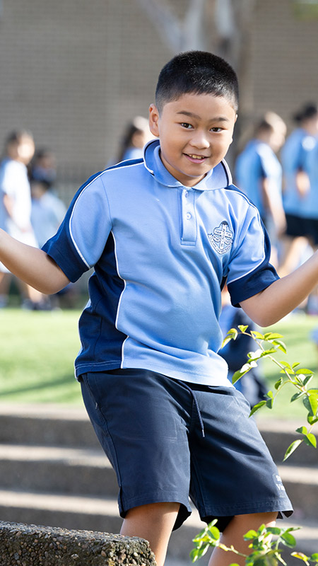 St John VIanney's Primary student shrugging his shoulders
