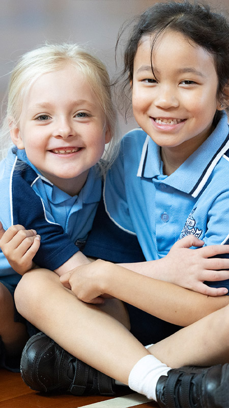 Two happy St John Vianney's Doonside students