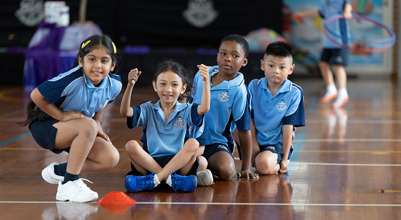St John Vianney's Doonside students playing sports in the hall