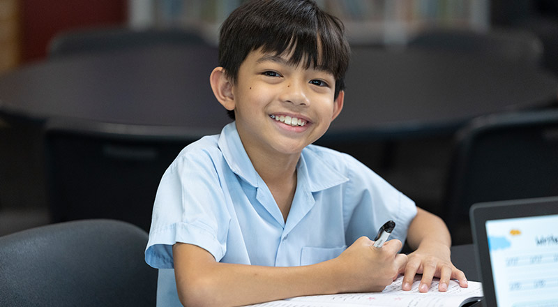 Boy studying at St John Vianney's Primary Doonside