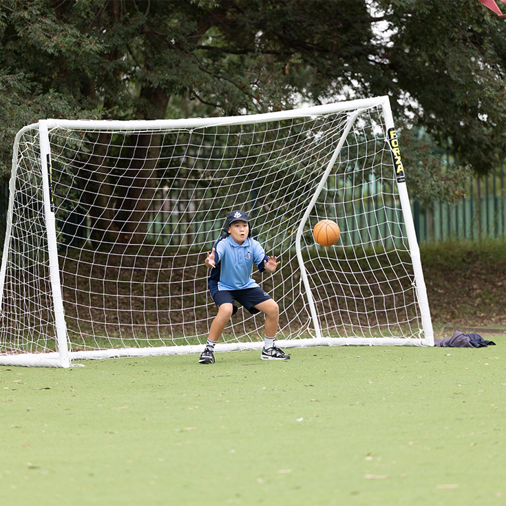 Student playing goalie at St John Vianney's Primary Doonside