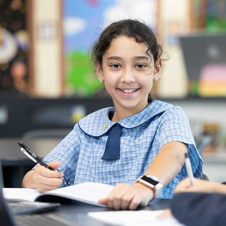 Happy student at St John Vianney's Primary Doonside