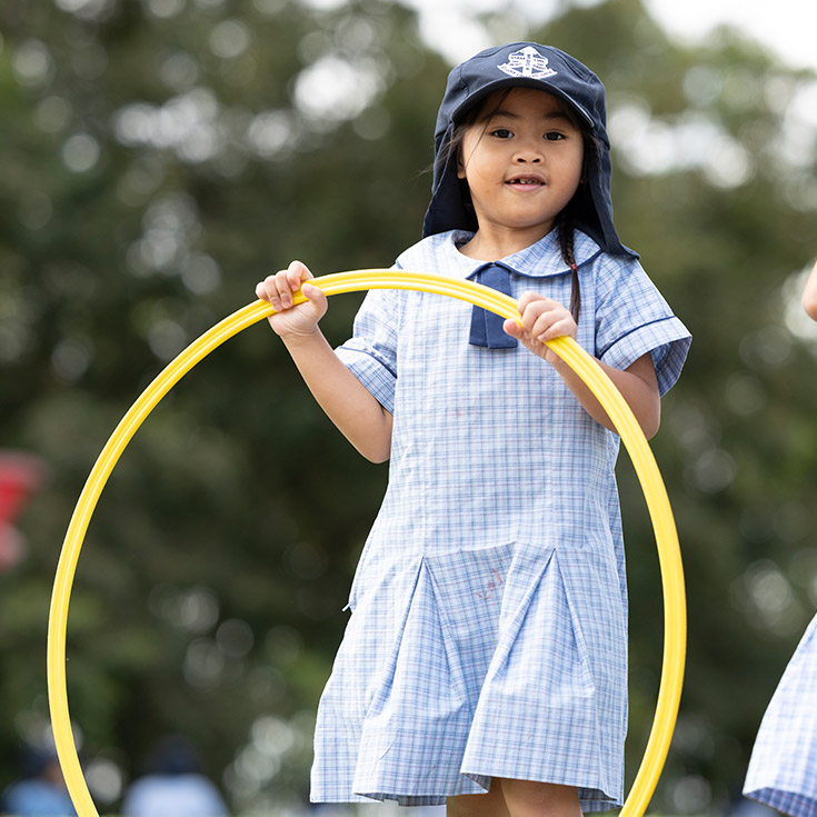 St John Vianney's Doonside student playing hoola hoop