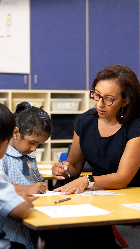 Jenny Godwin, Principal of St John Vianney's Primary, Doonside assisting students in class