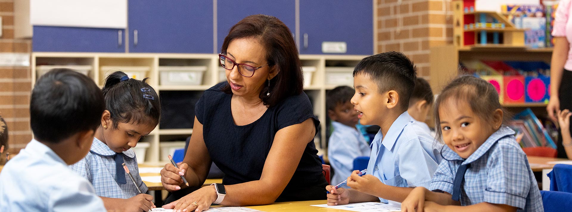 Jenny Godwin, Principal of St John Vianney's Primary, Doonside assisting students in class
